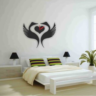Swan-shaped designer wall clocks installed above a modern bedroom bed