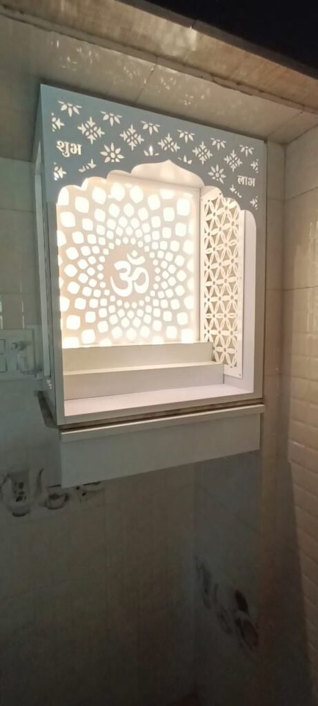 Acrylic Mandir Jali with illuminated Om mandala design and floral side panels in a modern home temple