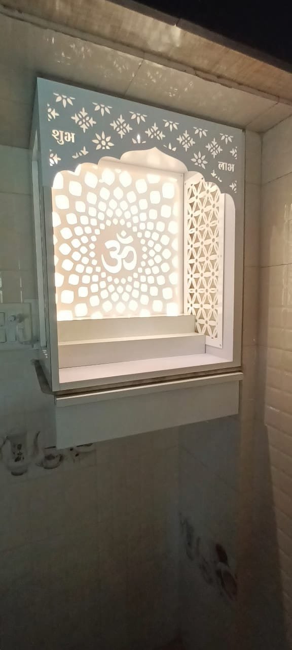 Acrylic Mandir Jali with illuminated Om mandala design and floral side panels in a modern home temple
