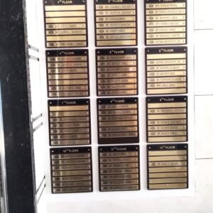 High-rise housing society name board for The Address B Wing listing 12 floors.